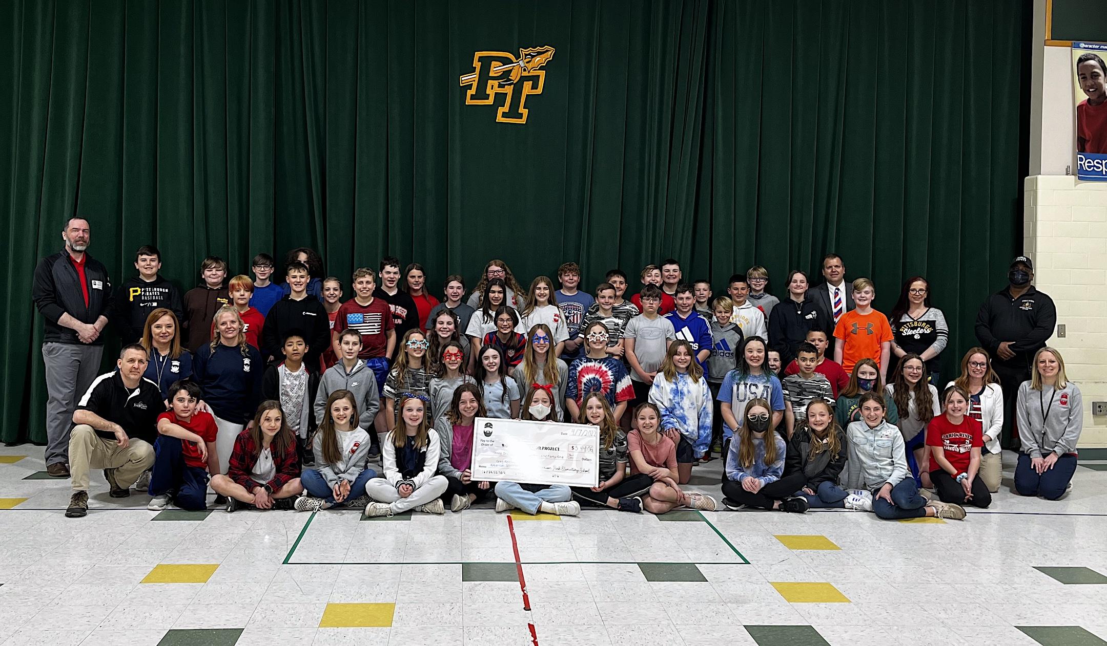 The fifth-graders gathered for the check presentation