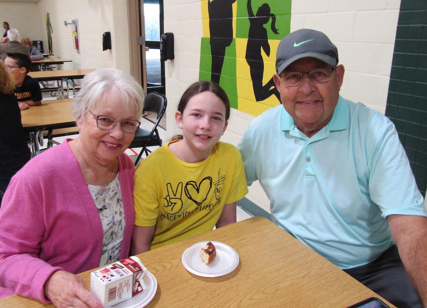 Fiona Plechey, fifth grade, and her grandparents spend quality time together during the breakfast