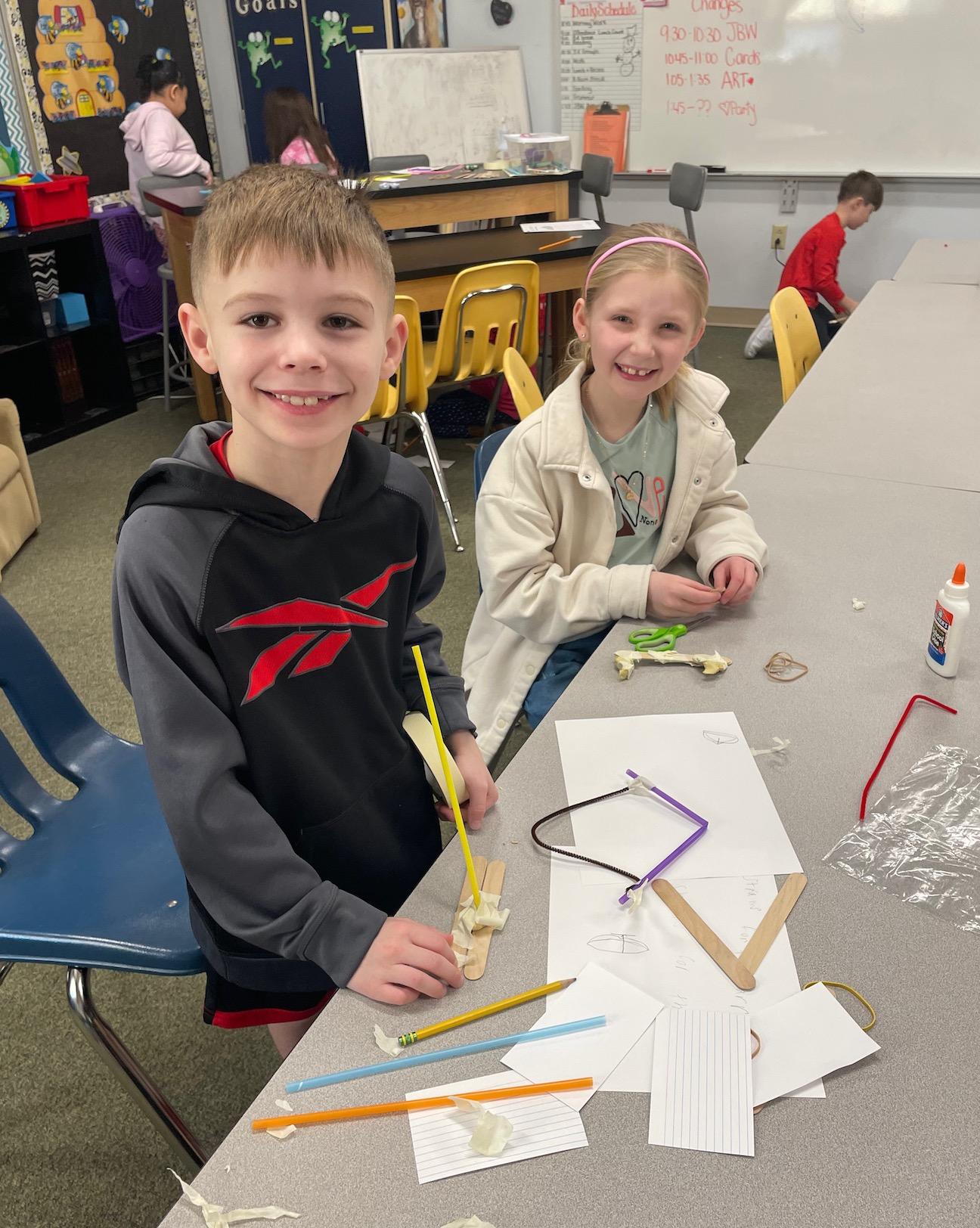 2nd-graders Enzo Mastroianni and Paisley Sullivan plan and build their device
