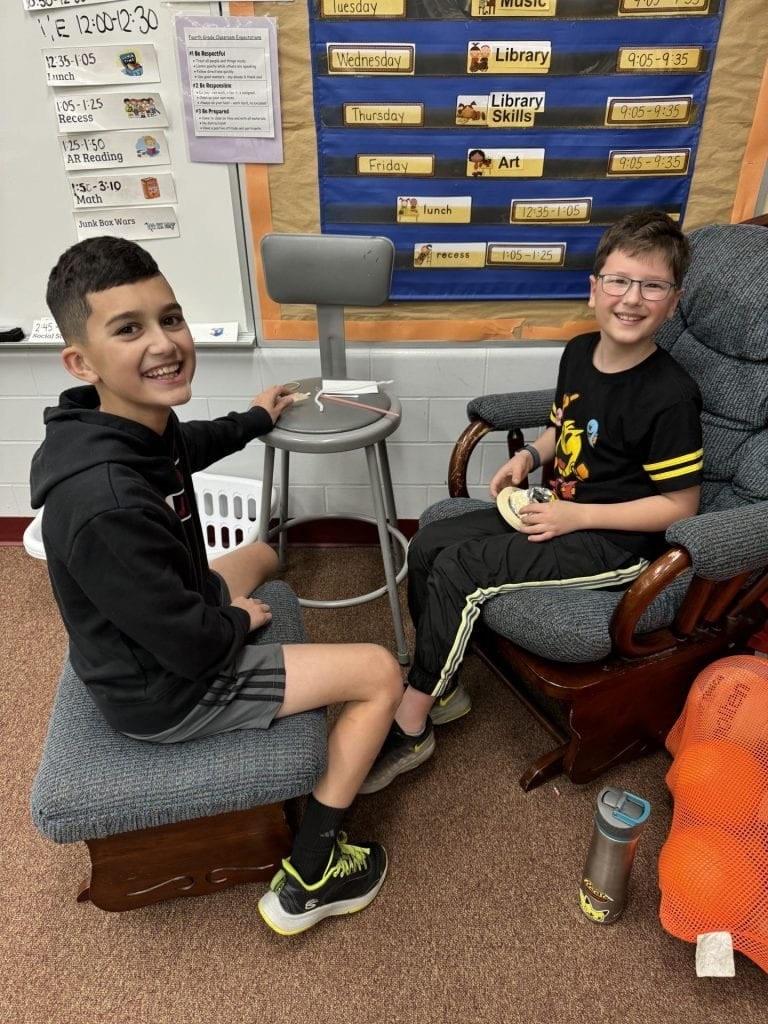 4th-graders Liam Walker and Jacob Dolhi build their pot of gold