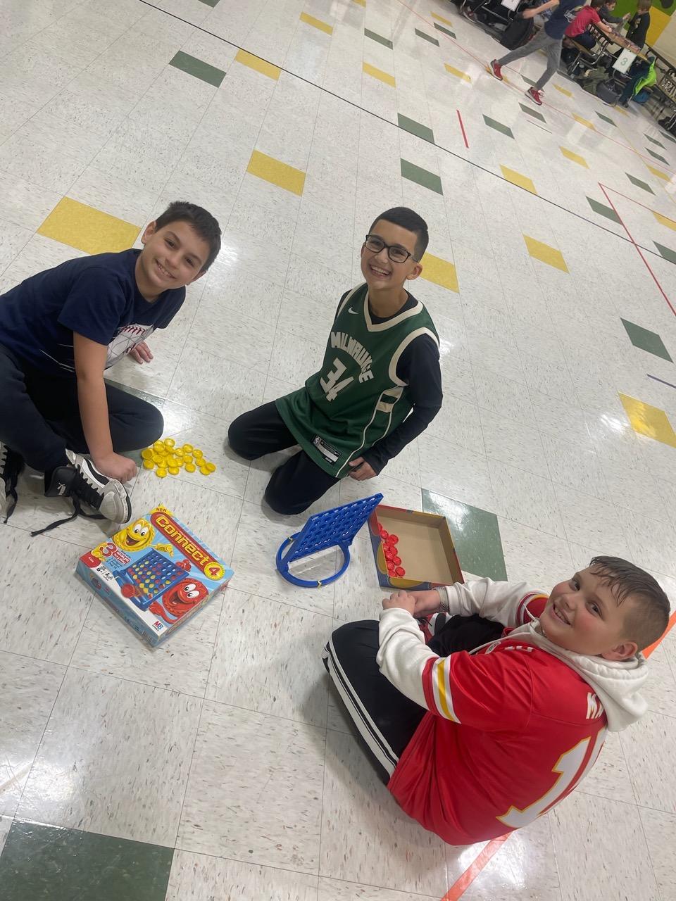 4th-graders Nico Leombruno, Liam Walker, and Cameron Kitchen enjoy a game of Connect4